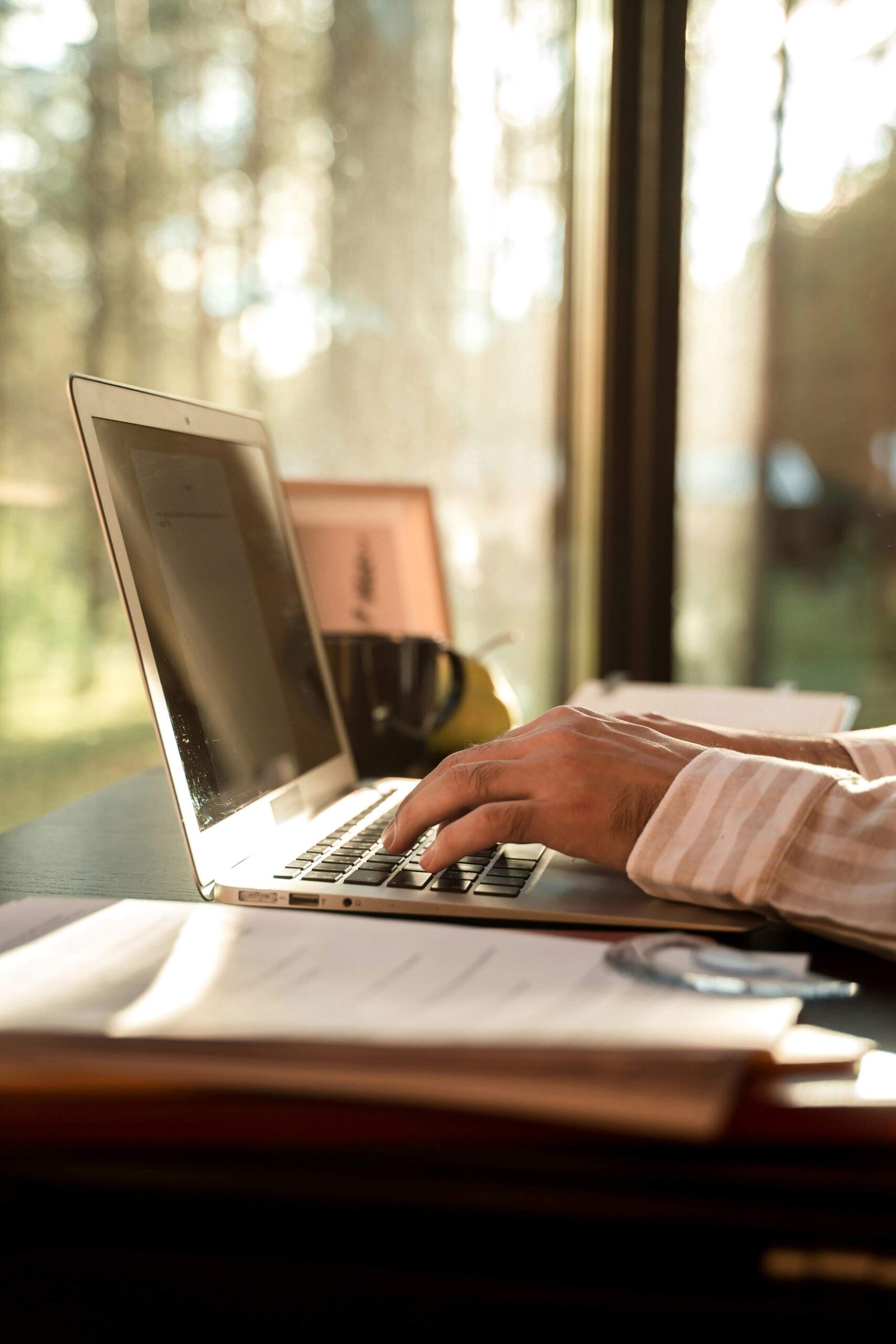 Person working on a laptop while planning a return to work after a career break